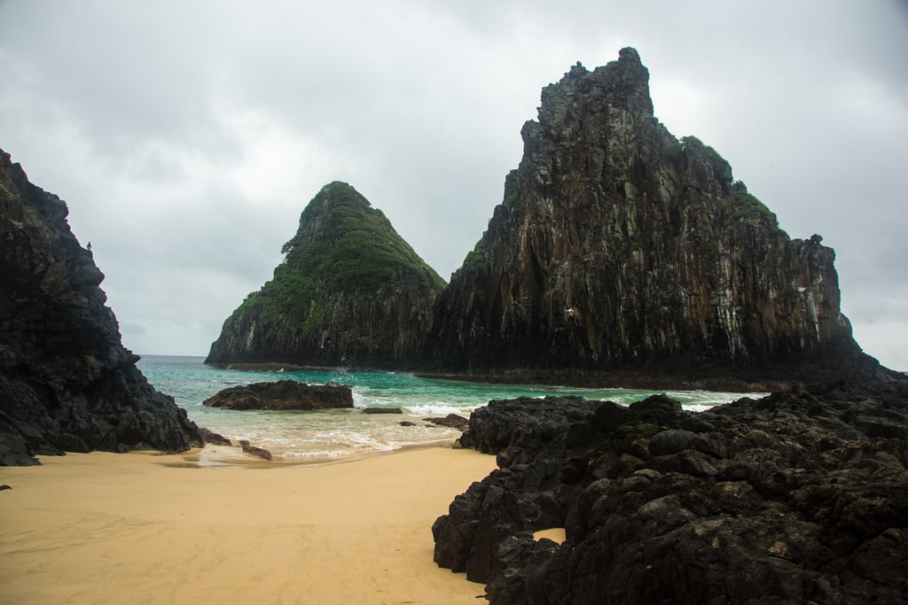 The twin volcanic peaks of Morro Dois Irmãos rising from the sea