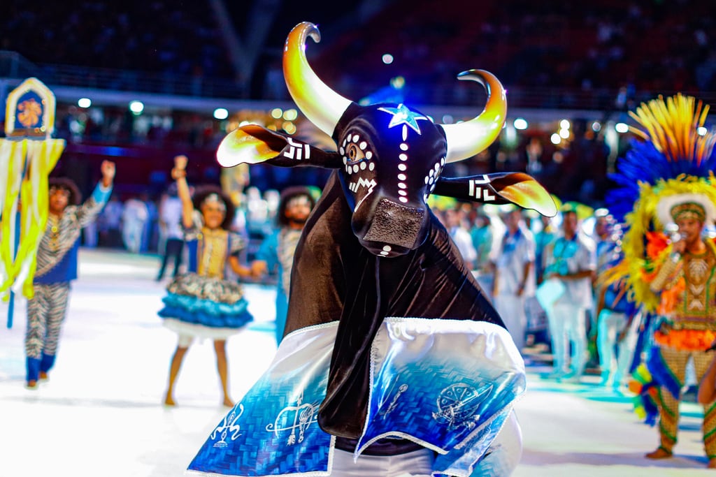 Boi Caprichoso performing in the arena with its blue-and-white ox figure
