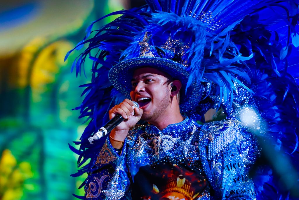 The levantador de toadas singing to the crowd during a Parintins performance